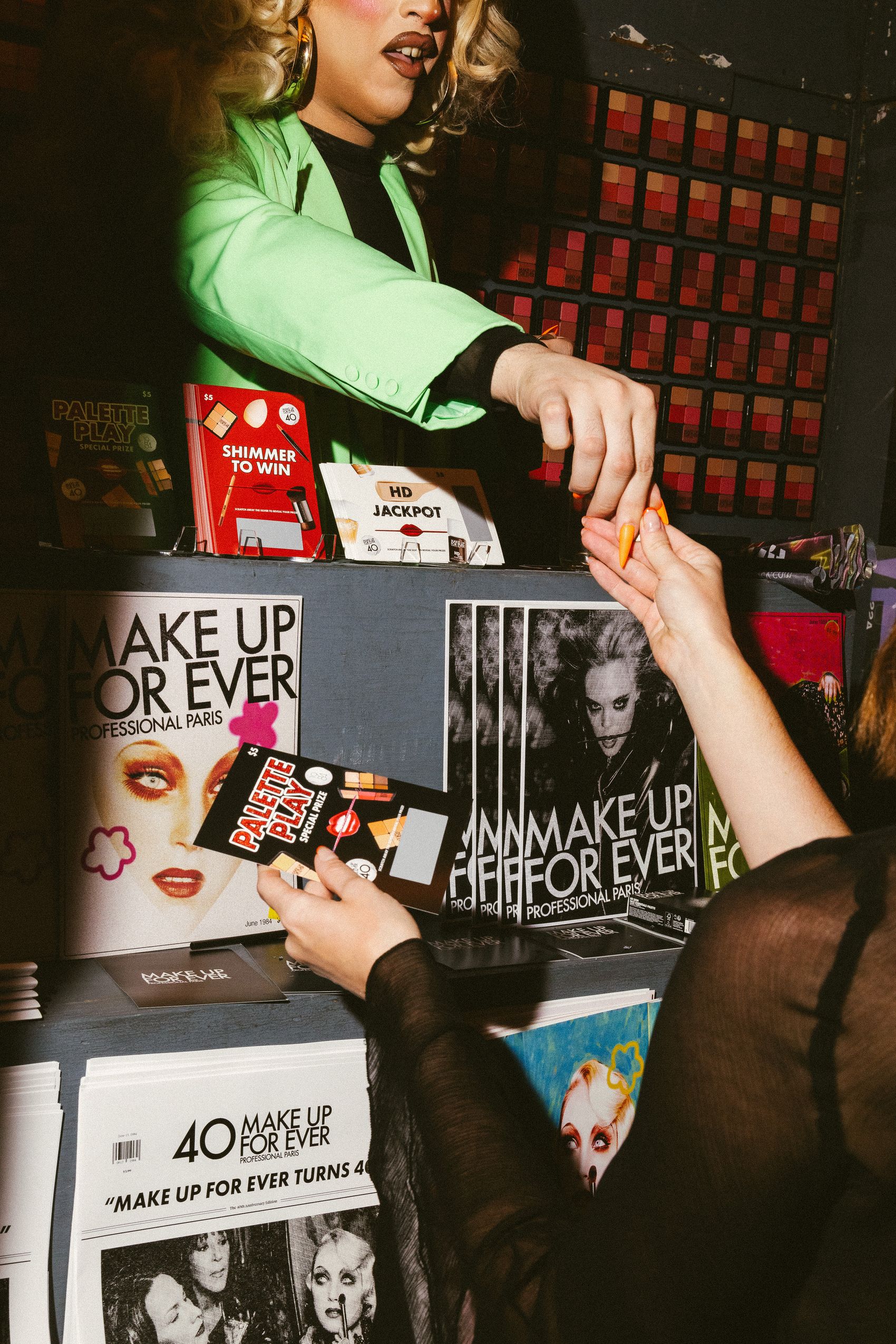 Guest reaching for a Make Up For Ever palette